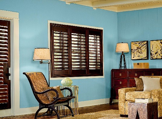 Custom interior plantation shutters in a dark finish within a Kansas City home by The Blind Broker.