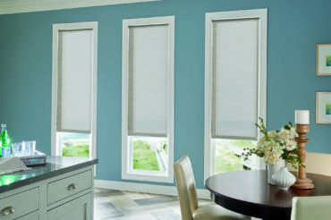 Graber solar shades in a home dining area, available at The Blind Broker of Kansas City.