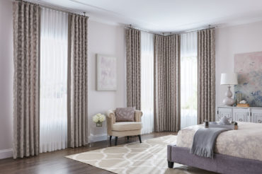 Graber drapery featured in a neutral-tone bedroom. Available at The Blind Broker of Kansas City.
