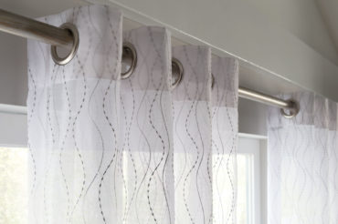 A closeup of Graber-brand drapery and hardware, showcasing fabric quality. Available at The Blind Broker of Kansas City.