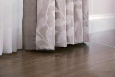 Gravery drapery in a mauve tone, including patterned fabric. Available at The Blind Broker of Kansas City.