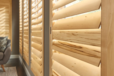 Graber wood shutters in a light wood finish. Available at The Blind Broker of Kansas City.