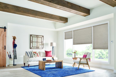 Graber cellular shades in a home's living space, allowing for controlled natural light. Available at The Blind Broker of Kansas City.