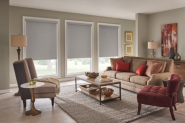 A warm Kansas City home's interior living space, featuring matching custom fabric shades by The Blind Broker.