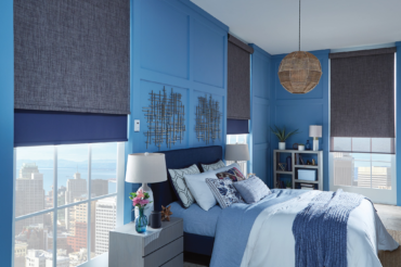 A set of custom motorized shades, color-coordinated to a contemporary Kansas City home by The Blind Broker.