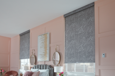 A set of roller shades by The Blind Broker of Kansas City, featuring custom patterned fabric.