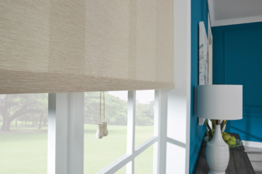 Custom fabric blinds in a Kansas City home, utilizing fabric that allows in some natural light, allowing for a warm interior space.