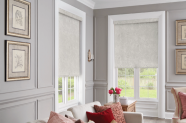 Custom fabric roller blinds in a Kansas City home's living space, by The Blind Broker.